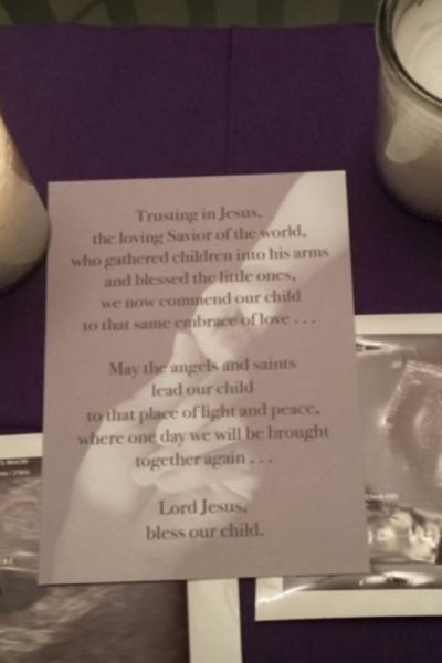 picture of ultrasounds with candles and ornament on table